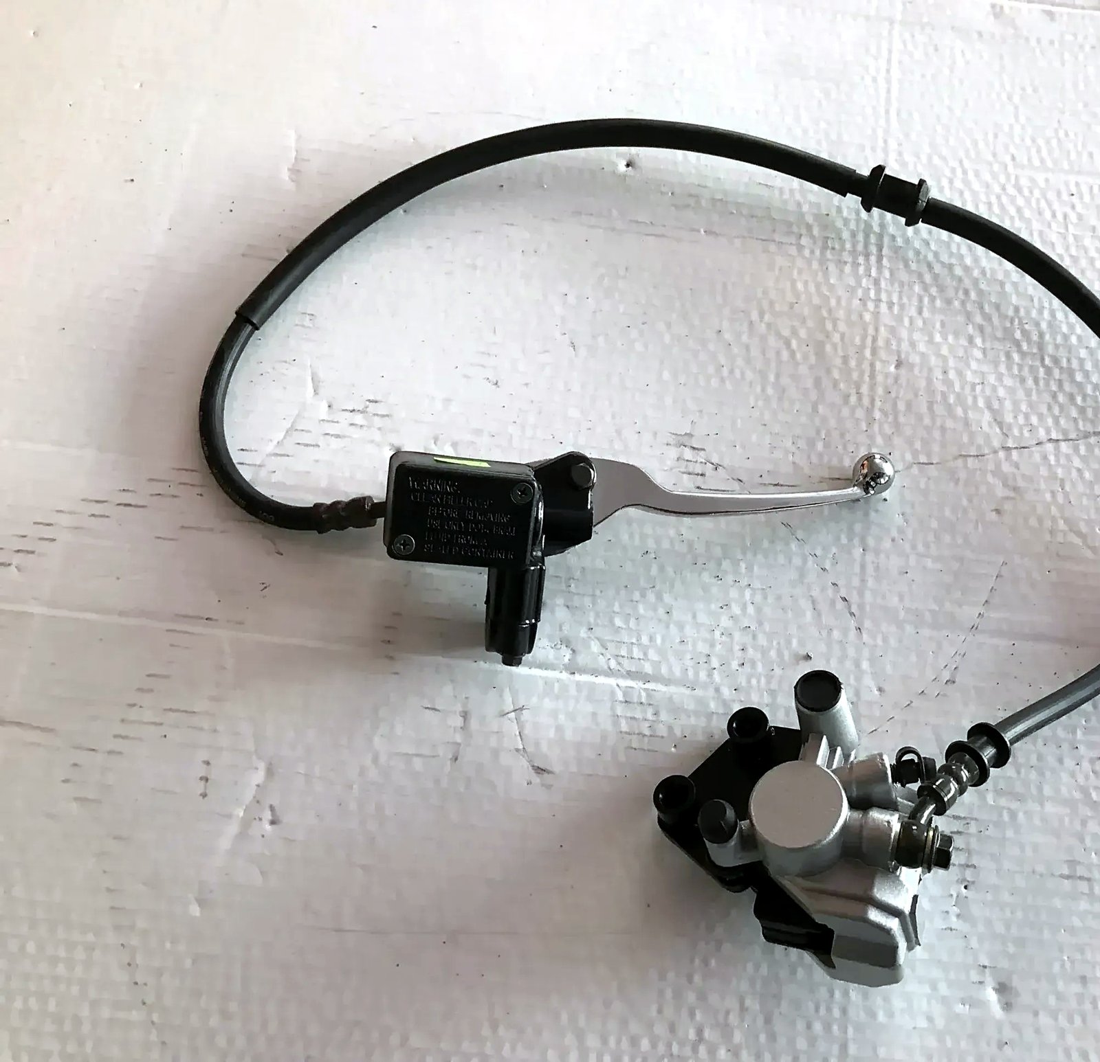 Front brake caliper for scooter